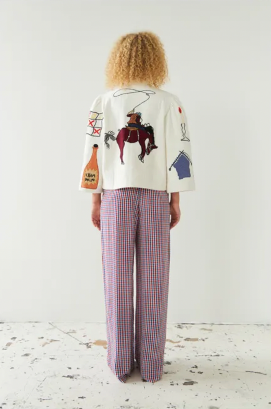 This circus embroidered jacket by Stella Nova features a unique print on both the front and back, making it a standout piece in your wardrobe. The crew neck and long, wide sleeves provide both comfort and style. With a front button closure, this jacket is perfect for any occasion.