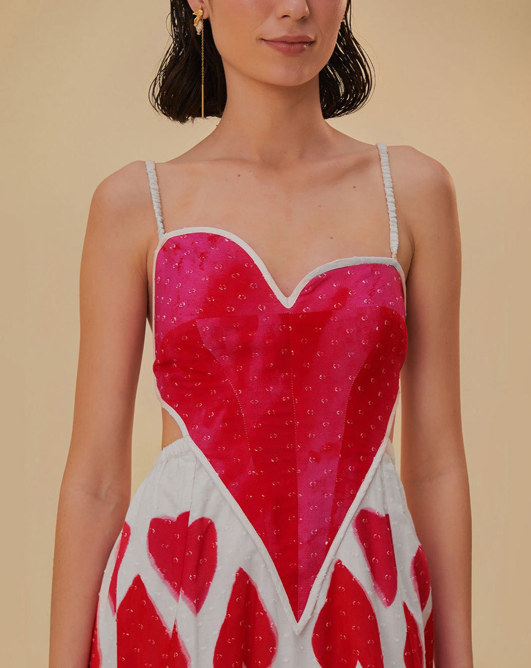 Elevate your style with our Painted Hearts Straps Maxi Dress! The striking red tie dye adds a touch of boldness to the classic spaghetti strap design. With its backless and high waist features, you'll exude confidence and sexiness whenever you wear it. Perfect for a night out or a special occasion.