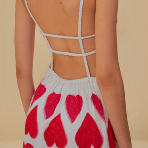 Elevate your style with our Painted Hearts Straps Maxi Dress! The striking red tie dye adds a touch of boldness to the classic spaghetti strap design. With its backless and high waist features, you'll exude confidence and sexiness whenever you wear it. Perfect for a night out or a special occasion.