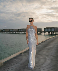 Looking to make a statement? The Magda Butrym Sequin Maxi Dress in Silver is a must-have item for your wardrobe. Its lightweight yet structured fabric creates a beautiful silhouette, while the soft and feminine color adds a touch of elegance. Perfect for any special occasion, this dress will be a timeless staple in your closet.