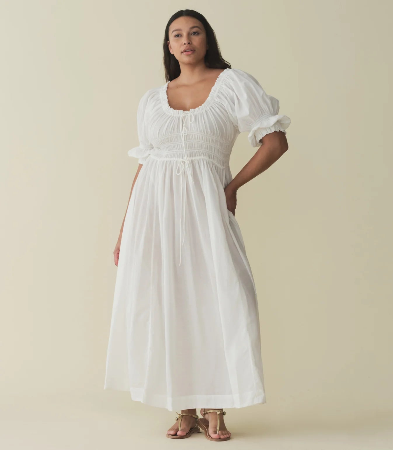 In a soft, lightweight blend of organic cotton and viscose, our beloved Ischia Dress—a Favorite Character that first made its debut in Spring 2021—features double-puffed sleeves and a scoop neckline adorned with petite ruffles and a functional center tie. A smocked bodice with an adjustable waist tie gives way to an ankle-grazing A-line skirt.