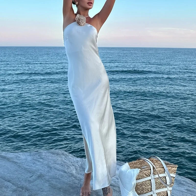 Introducing the Samantha Dress, a stunning addition to your wardrobe. Crafted from luxurious white satin, this elegant dress exudes sophistication and grace. Perfect for special occasions, it's the perfect choice for those looking to make a statement. Elevate your style with the Samantha Dress.