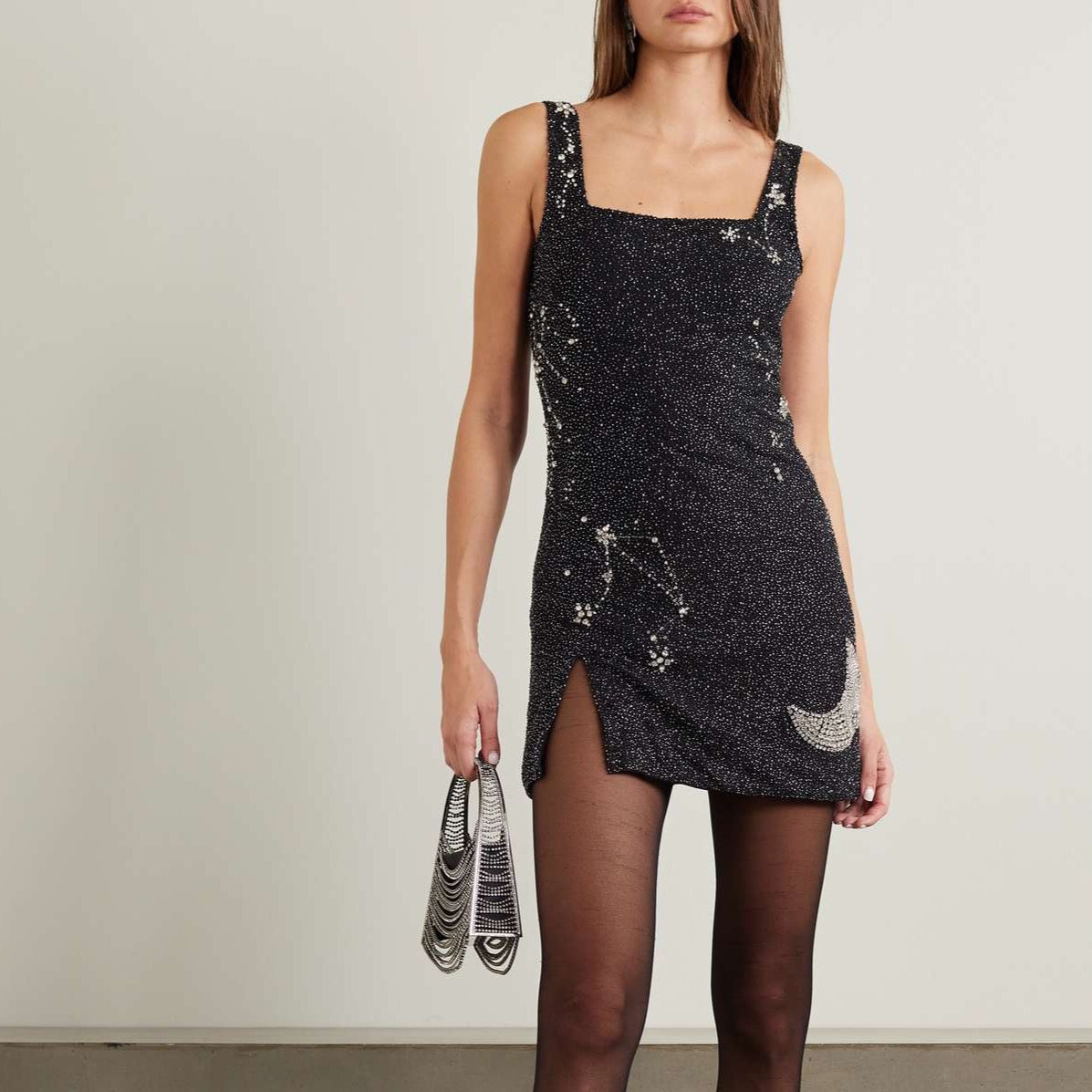 Indulge in the epitome of luxury with our STAUD Dress Le Sable. Adorned with crystal embellishments on beaded stretch-tulle, this mini dress exudes elegance and sophistication. Perfect for any occasion, it is a must-have for your wardrobe. Elevate your style and make a statement with Dress Le Sable.