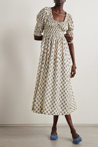 Indulge in the luxury of our Ischia Shirred Printed Organic Cotton-voile Midi Dress. Made with organic cotton-voile, this dress not only boasts a beautiful and vibrant print but also ensures high quality and sustainability. Perfect for any occasion, this dress will make you look and feel both sophisticated and exclusive.