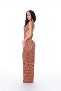 Elevate your evening with the Selena Dress. This maxi-length stunner in Warped Plaid will turn heads with its cinched waist and open back detailing. Designed for a flattering fit, it's the perfect choice for your next special occasion.