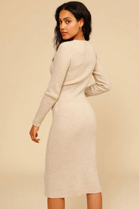 Experience effortless chic this autumn and winter with our Elona Midi Dress. Made from high-quality rib knit fabric, this vintage cutout dress features a figure-hugging silhouette, cascading cut-outs with bows, and a crew neckline. Perfect for work from home or dressing up on off-duty days. Complete the look with mid-calf heeled boots and a snakeskin baguette bag.