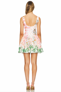 The Pluma Mini Dress from Agua by Agua Bendita features a back-zip closure and a darted bodice for a flattering and comfortable fit. The dropped bias-cut waistline and gathered waist seam accentuate the waist while the floral appliqué and crochet trim add a feminine touch. Fully lined for added comfort.