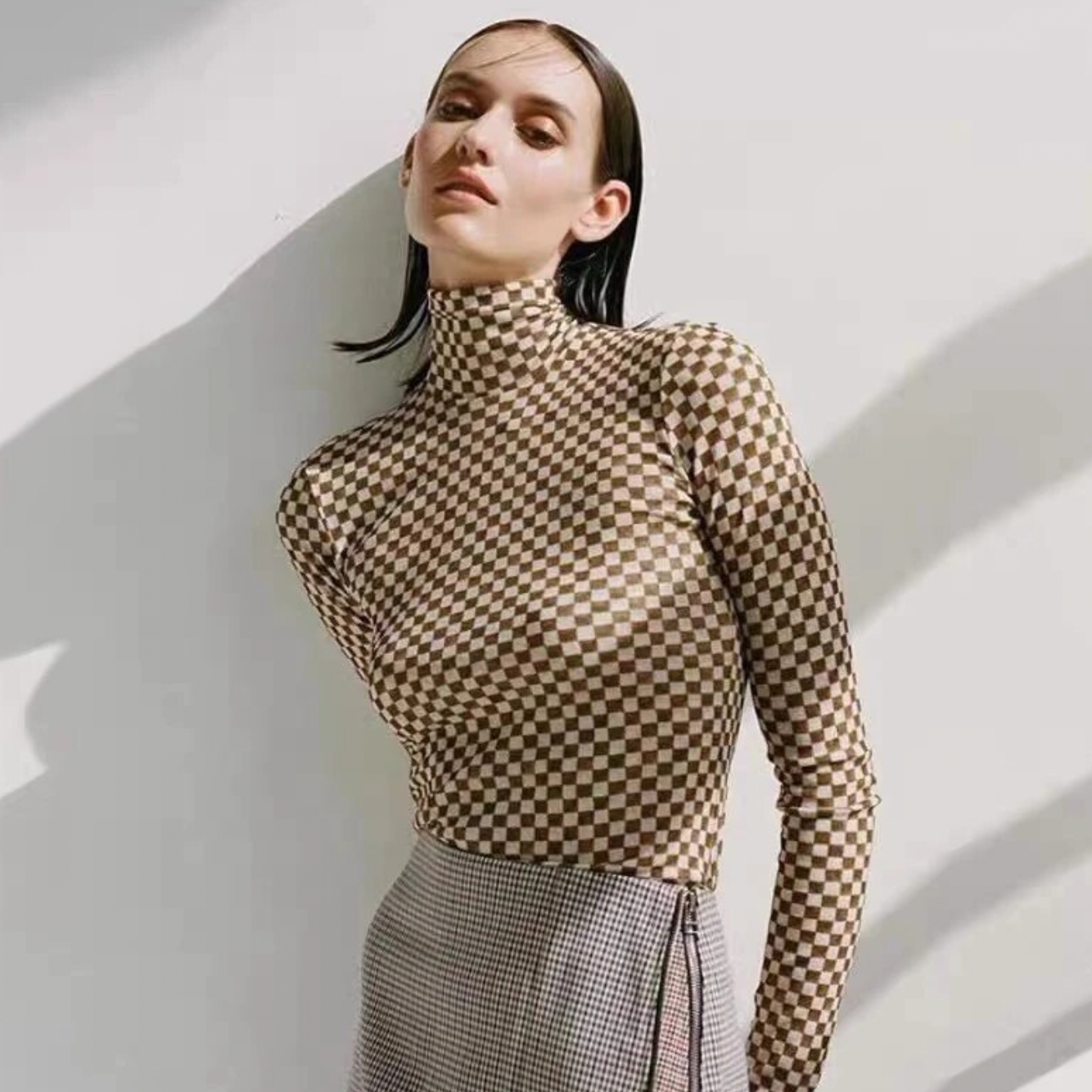 Elevate your wardrobe with NANUSHKA's Hapri Mesh Jersey Checked Sweater. With a high neck and unique checked design, this sweater is both stylish and practical. Made from comfortable and breathable fabric, you'll feel effortlessly chic. Perfect for any occasion, add this sweater to your closet for a versatile and fashionable addition.