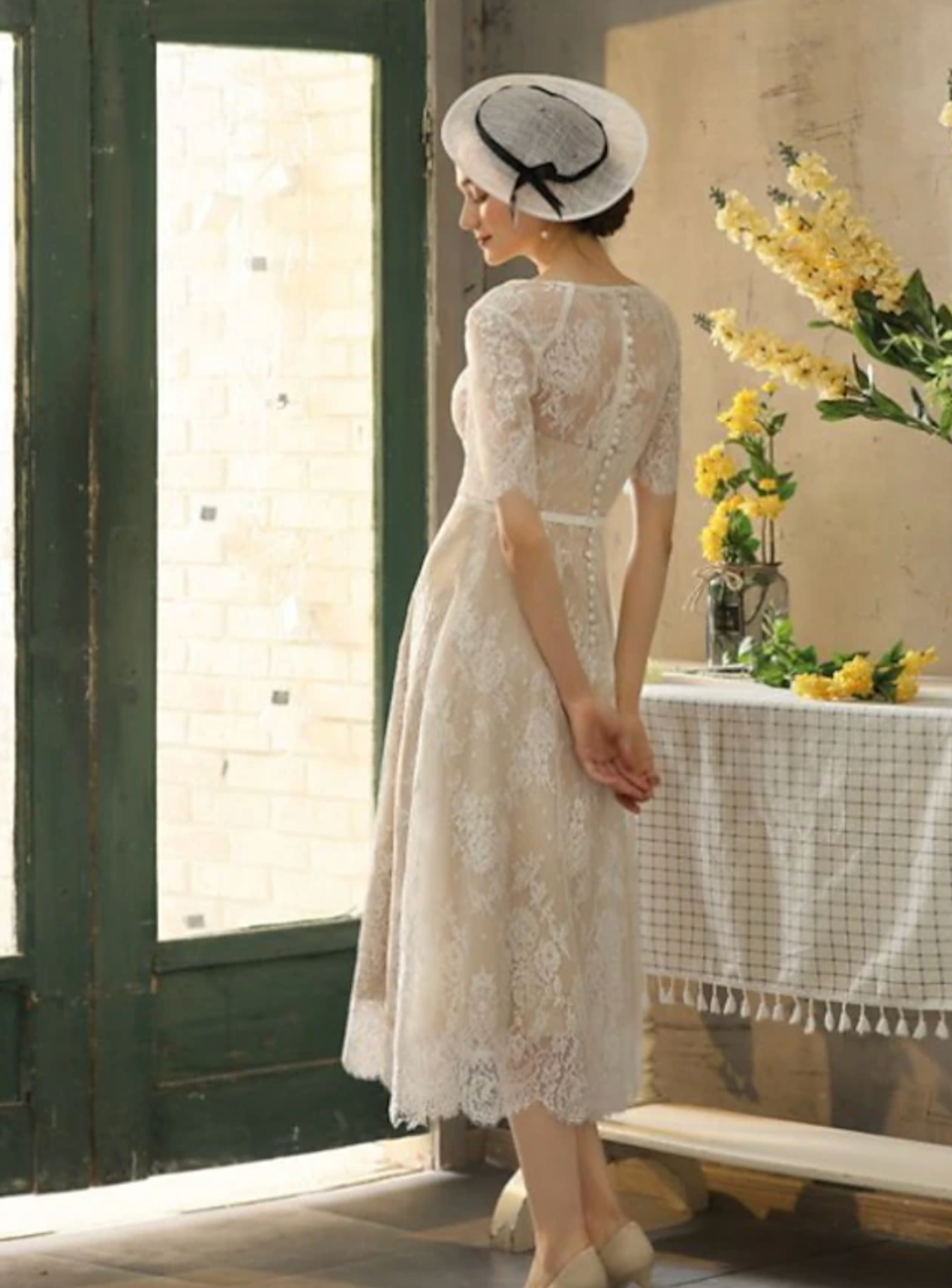 Introducing the Robe Violet, a stunning vintage tea length lace dress. This beautiful dress combines vintage elegance with modern design, creating a unique and timeless piece for any occasion. The delicate lace adds a touch of romance, while the tea length provides a flattering silhouette. Bring out your inner beauty with the Robe Violet.