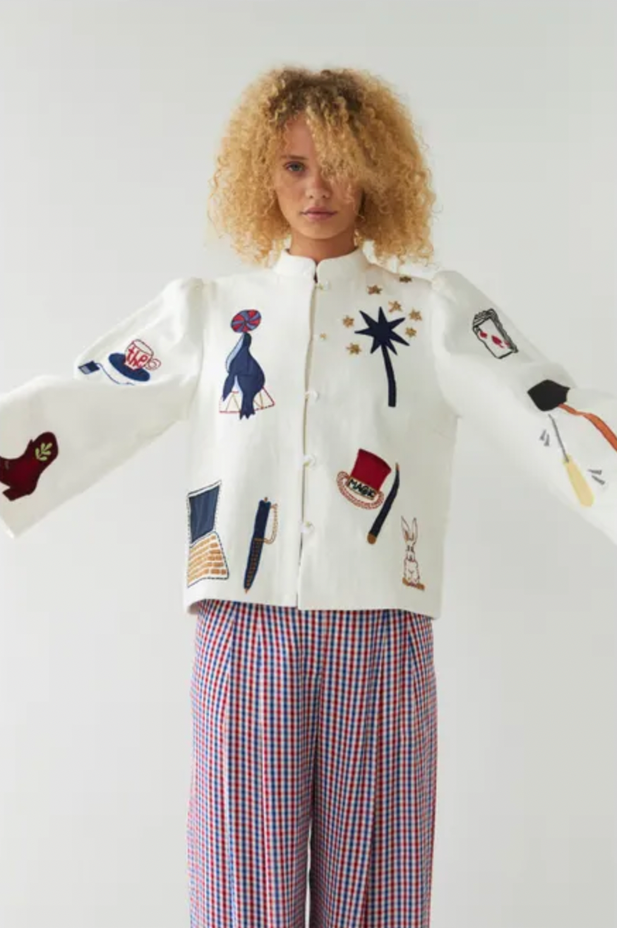 This circus embroidered jacket by Stella Nova features a unique print on both the front and back, making it a standout piece in your wardrobe. The crew neck and long, wide sleeves provide both comfort and style. With a front button closure, this jacket is perfect for any occasion.