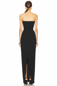 The Imani Gown features a hidden back zipper closure, boned bodice with neckline cut-out and tassel accent, and a crepe fabric with back vent. With its elegant design and functional details, this gown provides a seamless and comfortable fit for any formal occasion. Effortlessly make a statement and turn heads with this sophisticated and stylish piece.