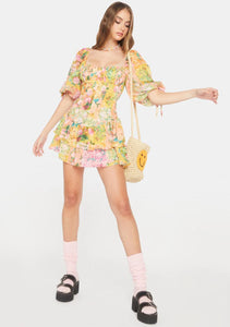 Introducing the playful and quirky Nina Mini Dress by For Love & Lemons! With its puff sleeves, square neckline, and ruched bodice, this mini dress offers a flattering and stylish silhouette. The feminine ruffle details and floral print add charm, while the convenient zip closure elevates your wardrobe. Don't miss out on this must-have piece!