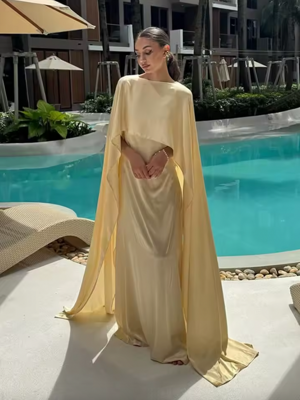 Elevate your style with the Arwa Dress! Made with elegant solid satin, this off-shoulder maxi dress exudes grace and sophistication. Perfect for any occasion, its scarf collar and long length add a touch of luxuriousness. Make a statement and turn heads at any party or holiday event with the new collection.