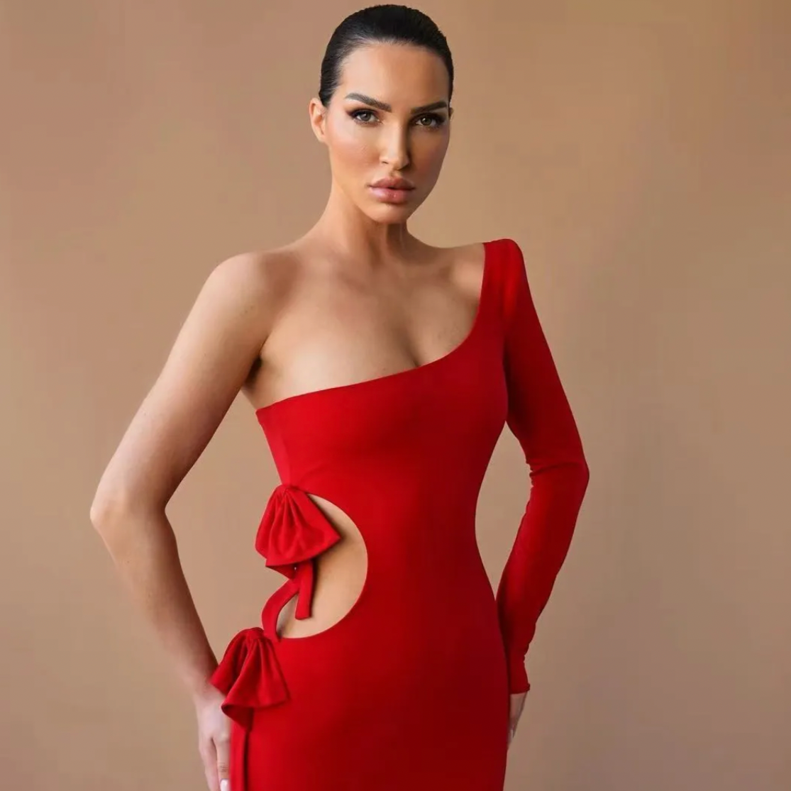 Glam up for any occasion with this elegant one-shoulder mermaid dress! The sensual hollow-out design adds a touch of drama, while the zipper up sheath cut keeps it classy. Let your inner risk-taker shine through with Robe Atana!