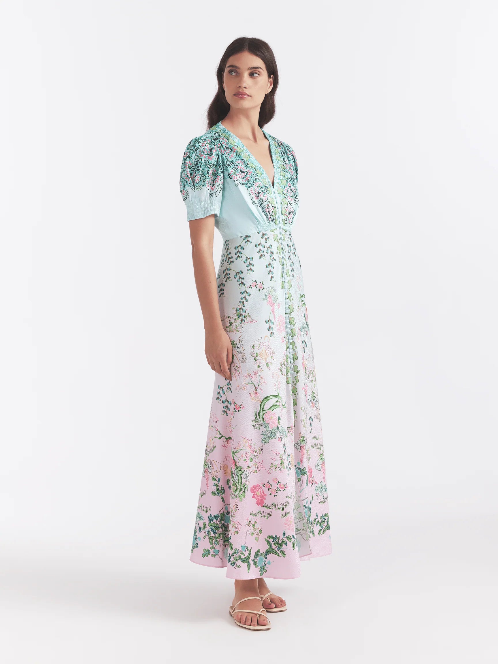 The Lea Maxi Dress, cut in a stamped satin, features a colour block placement with linear waves and paisley floral vines. Its bias cut flatters the figure and allows for fluid, easy movement. A must-have in any woman's wardrobe.