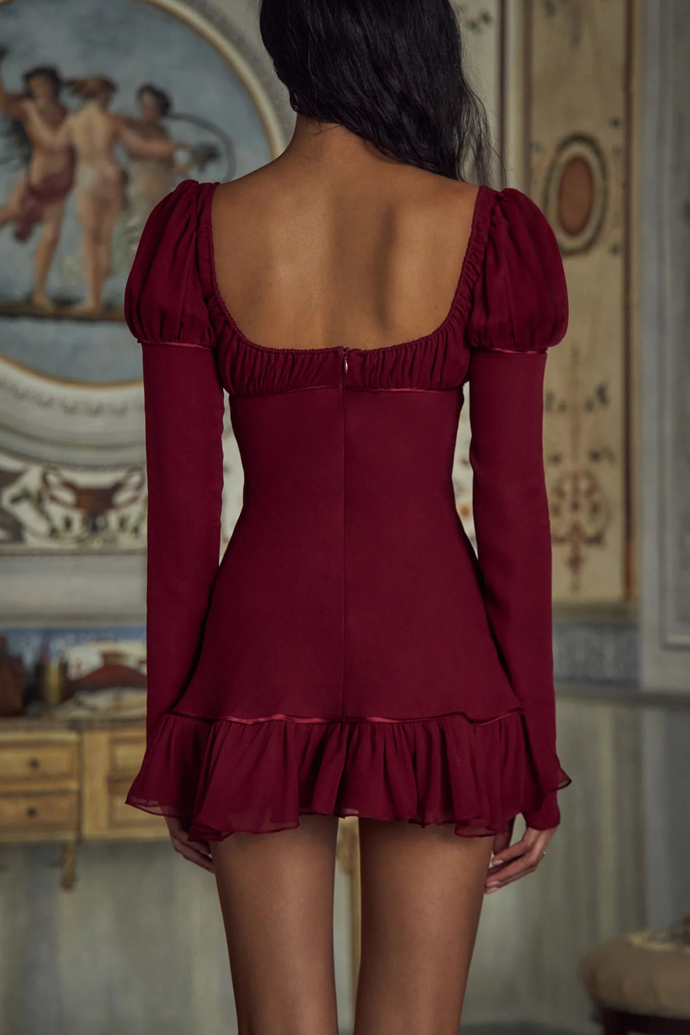 Unleash your bold and luxurious side with the Verona Micro Dress. This stunning mini dress features shirring on the bust, sleeves, and ruffle hem for a flattering fit. With an adjustable neckline and functional sleeve buttons, this dress exudes sophistication. Elevate your style and embrace the adventure with this exclusive piece!