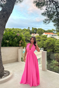 Elevate your style with the Susanna Dress. Its cross V-neckline and pleated edges add unique sophistication, while the bright pink georgette chiffon fabric and satin lining exude luxury. Perfect for weddings, parties, and summer outings, this flowing dress will make you feel like a true fashionista.