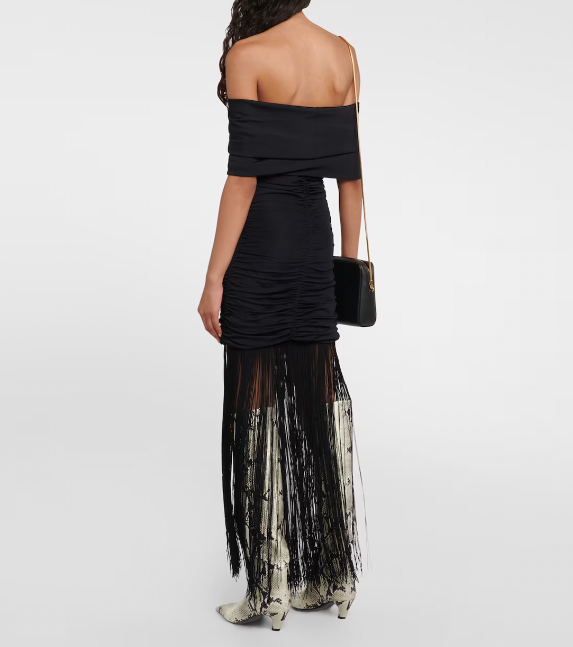 Introducing the Jacinta Maxi Dress by Khaite - a fusion of elegance and modernity. This luxurious slip-on dress boasts an off-shoulder neckline, adorned with long fringes and full ruching for a flattering silhouette. Perfect for any special occasion, elevate your style with this sophisticated must-have.