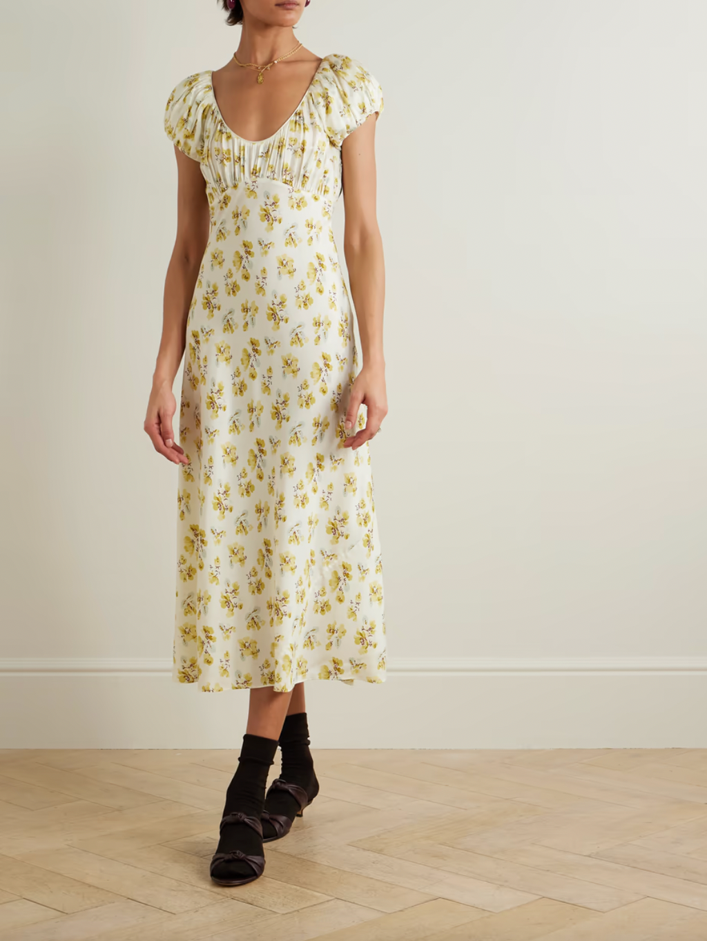 Indulge in luxury with the 'Florencia' midi dress. It exudes 1930s glamour with a vintage floral design and delicate gathering at the bodice. Made from a fluid silk-blend, this dress is cut on the bias for a flattering fit and has playful puffed cap sleeves. A sophisticated addition to your wardrobe.