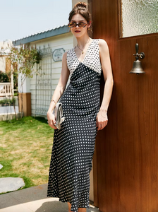 Introducing the Britta Dress, your new retro revival go-to. With a flattering V-neck and contrasting polka dot print, this dress is both fun and sophisticated. The unique neckline add an elegant touch to this must-have piece. Elevate your style with the Britta Dress.