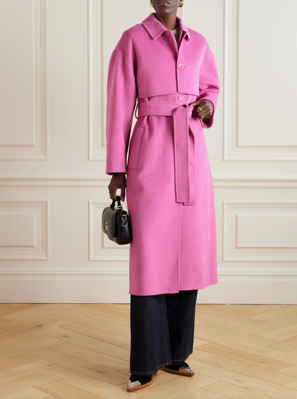 Experience the perfect blend of warmth and style with the Romi wool-blend coat. Made with high-quality wool and designed to resemble a classic trench style, it features prominent storm flaps and a tie belt to define your waist. Enjoy the cheerful shade of pink, called 'Flora', and embrace fashion and functionality with this must-have coat.