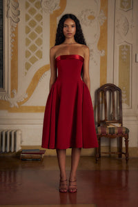 Indulge in luxury with the Scarlet Charmeuse Dress. This strapless, lady length dress boasts a fold over collar in silk charmeuse and a built-in inner bodice with silicone gripper elastic. Equipped with godets at the high hip and invisible zipper, it offers both style and convenience. Feel chic and confident with this elegant dress.