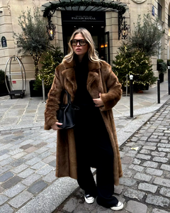 Elevate your style with the Daphne Shearling Coat. This faux fur masterpiece seamlessly blends textures and patterns for a luxurious and sophisticated aesthetic. The camel-colored coat not only adds warmth but also exudes opulence. Make a statement and elevate your wardrobe with this must-have piece.