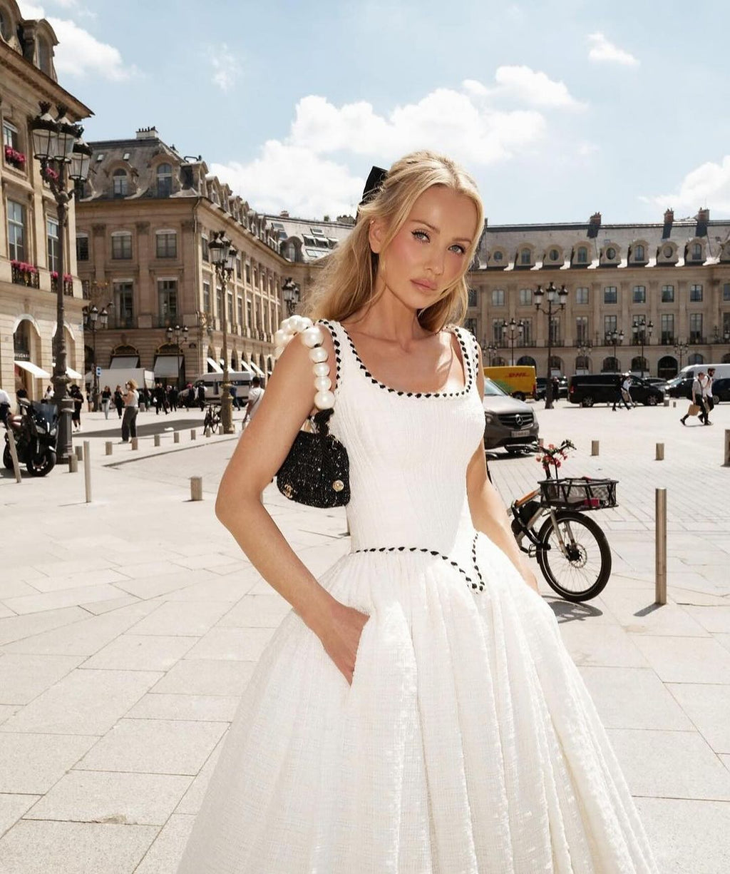 Indulge in the alluring beauty of the Angelique Gown. This exquisite bridal gown exudes elegance and sexiness with its chic parisian design and corset bodycon silhouette. The strapless neckline adds a touch of sophistication to this must-have dress for any bride.