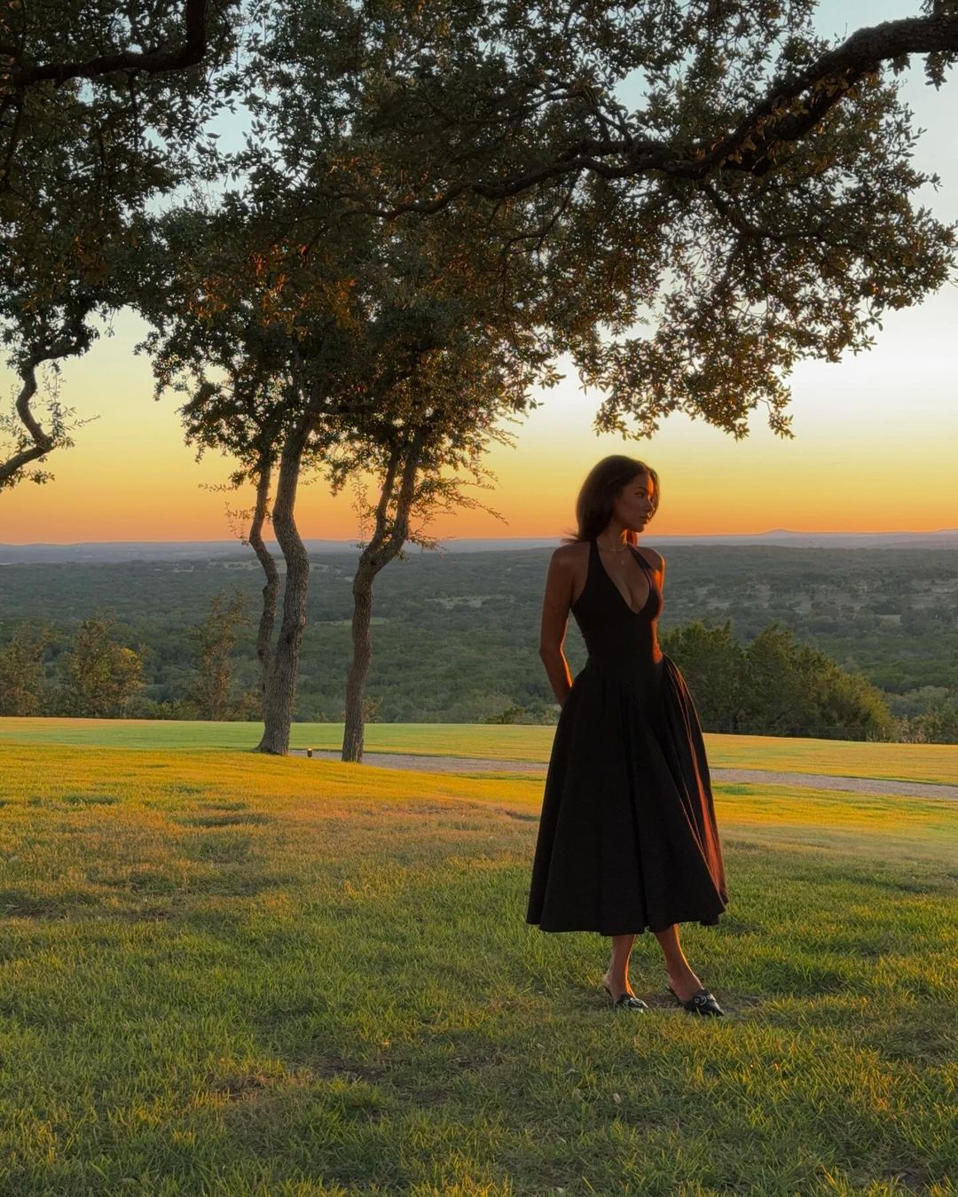 Indulge in old-Hollywood glamour with a modern twist in the Marilyn Midi Dress. Made from soft peached twill in classic black, this dress features tied halter straps, a plunging neckline, cinched waist, and a flattering silhouette. Channel your inner starlet and turn heads in this stunner!