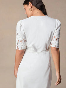 This stunning Audrey Midi Dress is perfect for any occasion. The elegant white embroidery adds a touch of sophistication, while the mid-length and wrap design create a flattering and versatile silhouette. Dress it up or down, this dress is sure to make you feel confident and chic!