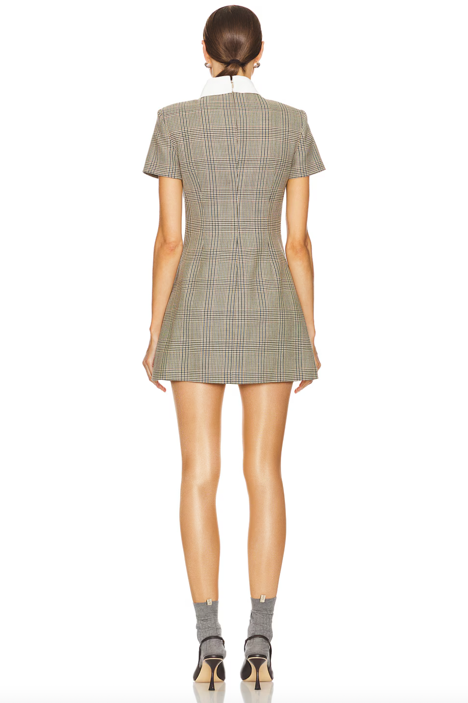 Indulge in luxury with the fully lined Check Wool Mini Dress by Self-Portrait. With pull-on styling and a faux front button closure, this dress is both convenient and elegant. The 4-pocket design adds functionality to the sophisticated midweight twill fabric, complete with padded shoulders for a chic and bold silhouette.