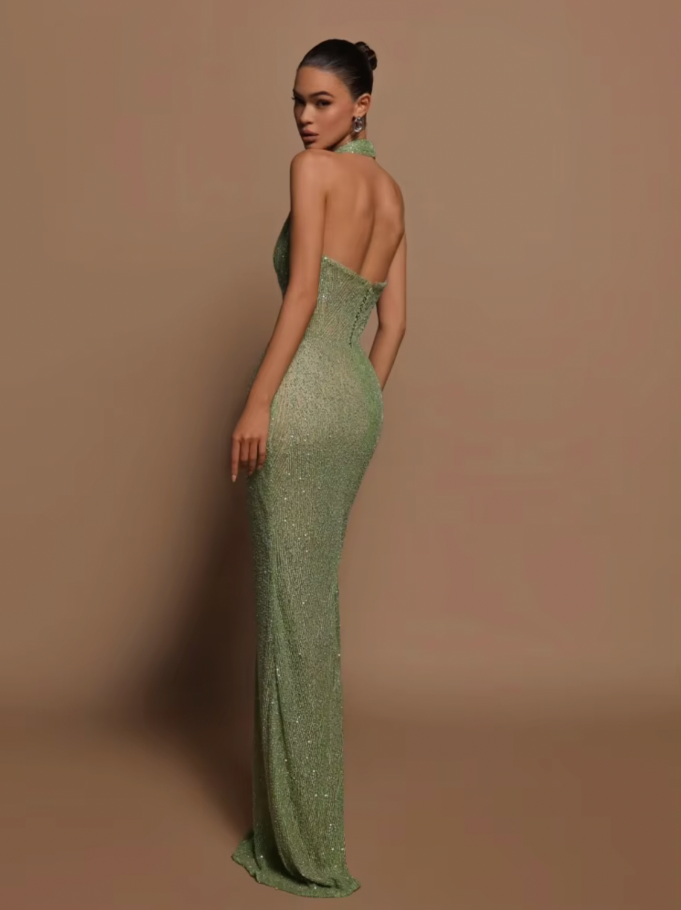 Introducing the Zinnia Sparkling Gown, a true showstopper. Embellished with delicate beads, this gown exudes luxury and sophistication. The halter neck adds a touch of elegance, while the sheer lining creates a sense of allure. Perfect for formal events or special occasions, feel like a true queen in the Zinnia Gown.