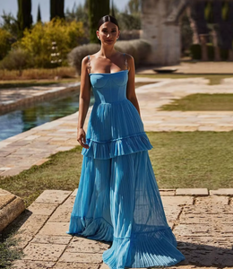  Indulge in elegance with the Eden Maxi Dress. The sky-blue mesh fabric creates a graceful silhouette with a structured boned bustier bodice, adorned with delicate spaghetti straps. The pleated A-line maxi skirt adds a touch of sophistication to your every step. Perfect for any special occasion.