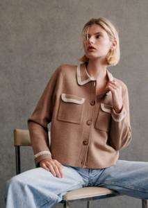 Expertly crafted from soft merino wool, the Betty Cardigan is perfect for cooler days. With a classic shirt collar and pockets on the chest, this short cardigan is finished with delicate crochet details on the collar, pockets, and cuffs. Elevate your wardrobe with this timeless and versatile piece.