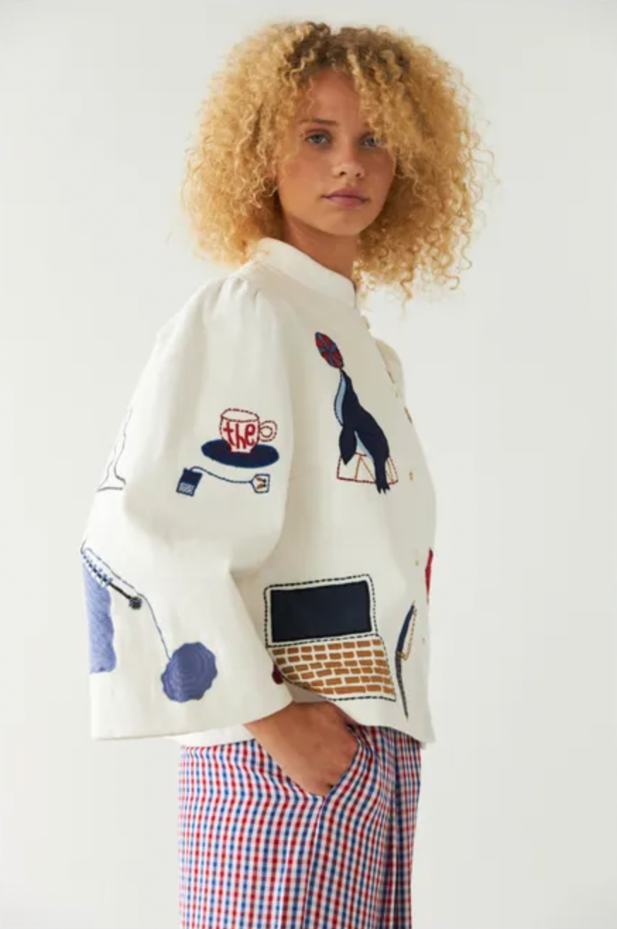 This circus embroidered jacket by Stella Nova features a unique print on both the front and back, making it a standout piece in your wardrobe. The crew neck and long, wide sleeves provide both comfort and style. With a front button closure, this jacket is perfect for any occasion.