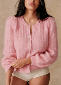 Expertly crafted from a luxurious blend of wool and super kid mohair, the Amance Cardigan is a stylish and cozy addition to your wardrobe. With its intricately patterned knit, round neckline, and tonal buttons, this long-sleeved cardigan offers both warmth and sophistication. Elevate your look with this timeless piece.