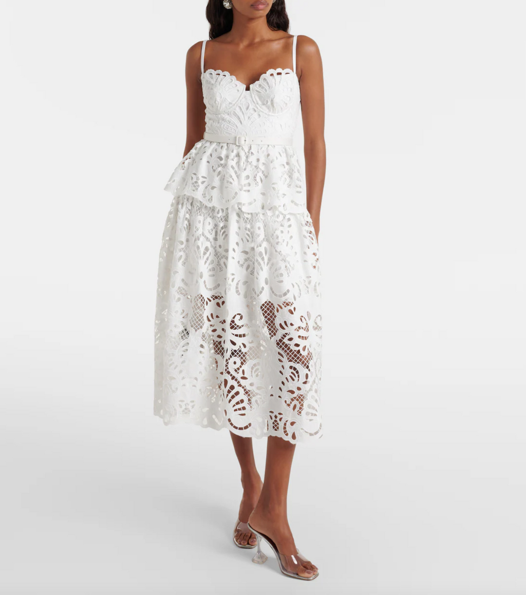 Elevate your style with the SELF-PORTRAIT Cotton Lace Midi Dress. This elegant dress features intricate lace details and a midi length, perfect for any occasion. Crafted from soft cotton, it offers both comfort and sophistication. Make a statement in this timeless piece.