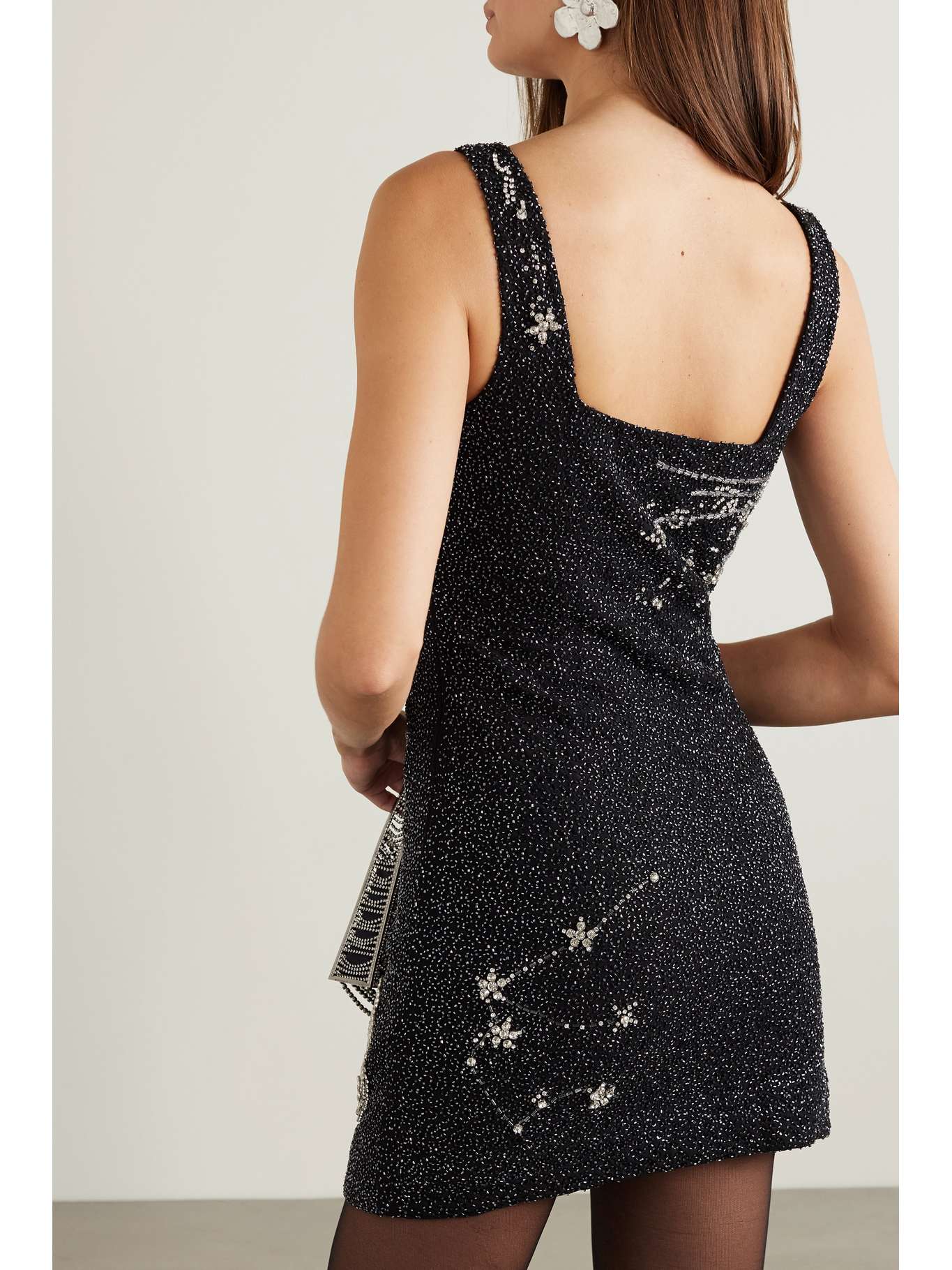 Indulge in the epitome of luxury with our STAUD Dress Le Sable. Adorned with crystal embellishments on beaded stretch-tulle, this mini dress exudes elegance and sophistication. Perfect for any occasion, it is a must-have for your wardrobe. Elevate your style and make a statement with Dress Le Sable.