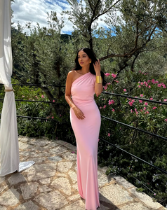 Elevate your style with the Fabienne Gown. Its one-shoulder design and adjustable strap detail give a sophisticated edge, while the stretch Cavalli fabric flawlessly hugs your curves. The contoured, full-length skirt and curved line details highlight your feminine silhouette. A versatile and elegant choice for any special occasion.