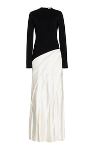 Indulge in luxury with the Ismay Silk Pleated Maxi Dress by Gabriela Hearst. This elegantly crafted piece boasts a clever design, featuring a black silk knitted bodice and a white pleated satin skirt for a striking contrast. The sharp pleats create beautiful movement as you walk, while the mock neckline adds a touch of sophistication. Perfectly paired with classic pumps for a timeless look.