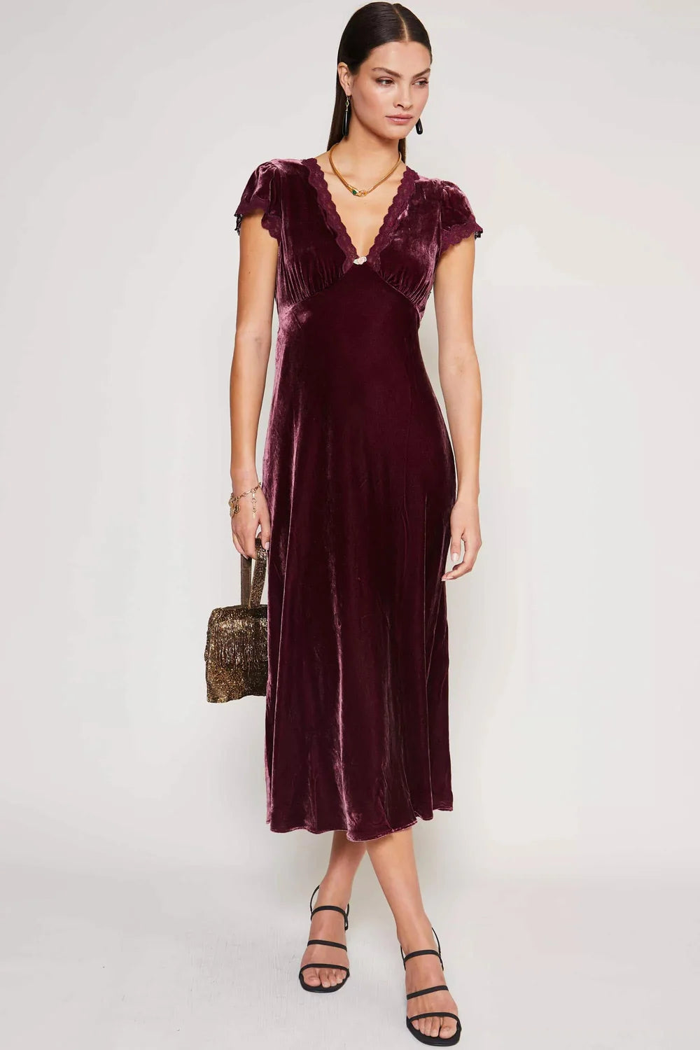 Elevate your evening look with the Clarice Velvet Midi Dress. Crafted from a lavish blend of silk and velvet, this dress exudes opulence and sophistication. Its soft texture and elegant silhouette make it the perfect choice for any party or special occasion. Turn heads and feel like a true VIP in this luxurious dress.