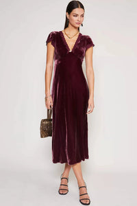 Elevate your evening look with the Clarice Velvet Midi Dress. Crafted from a lavish blend of silk and velvet, this dress exudes opulence and sophistication. Its soft texture and elegant silhouette make it the perfect choice for any party or special occasion. Turn heads and feel like a true VIP in this luxurious dress.