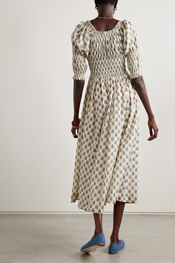 Indulge in the luxury of our Ischia Shirred Printed Organic Cotton-voile Midi Dress. Made with organic cotton-voile, this dress not only boasts a beautiful and vibrant print but also ensures high quality and sustainability. Perfect for any occasion, this dress will make you look and feel both sophisticated and exclusive.