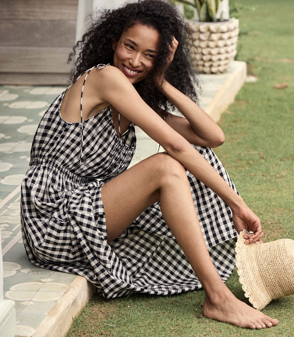 Experience effortless charm and comfort with the Leslie Dress in Marilyn Gingham! This Doen dress features a classic gingham pattern and lightweight fabric for all-day wear. The A-line silhouette is enhanced with adjustable shoulder ties and an elasticized waist for a flattering fit. Perfect for any outdoor occasion, pair it with sandals and a wide-brimmed hat for an easy, breezy look.