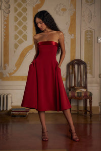 Indulge in luxury with the Scarlet Charmeuse Dress. This strapless, lady length dress boasts a fold over collar in silk charmeuse and a built-in inner bodice with silicone gripper elastic. Equipped with godets at the high hip and invisible zipper, it offers both style and convenience. Feel chic and confident with this elegant dress.