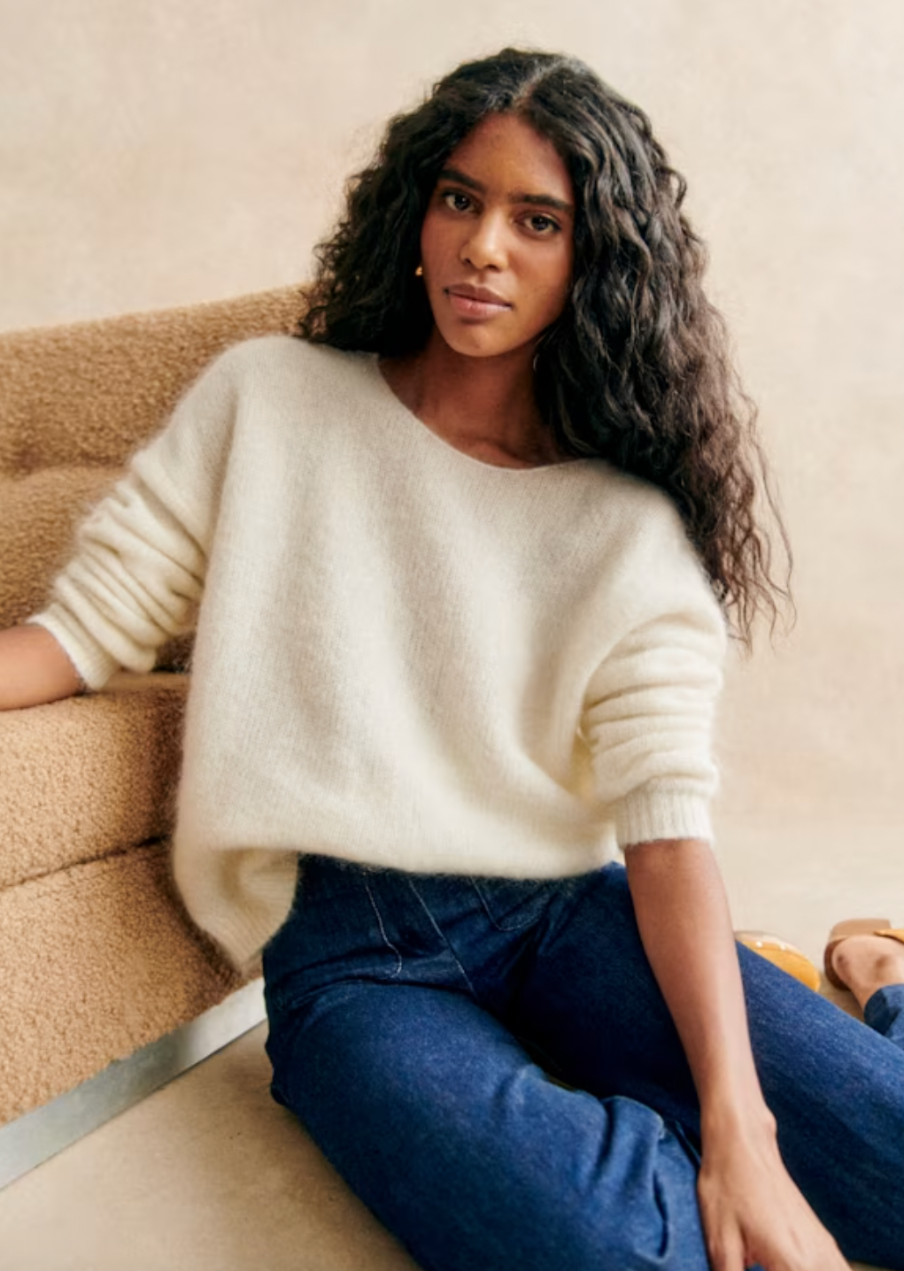 Indulge in luxury with the Astride Jumper. Crafted from a blend of wool and kid mohair, this long-sleeved jumper offers an elegant and slightly oversized fit. The lace inserts along the placket add a delicate touch, while the round neckline at the front and V at the back exude sophistication. Complete with tone-on-tone buttons, this jumper is a must-have for the discerning fashionista.