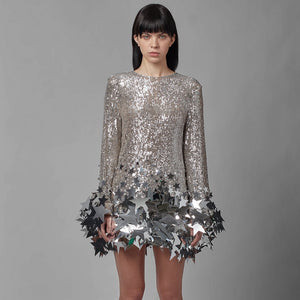 Indulge in the allure of our Dress Star - a growing star shift dress that exudes luxury. Adorned with sexy sequins and a silver mini dress design, this dress is perfect for the sophisticated woman. Elevate your style with elegance and allure.