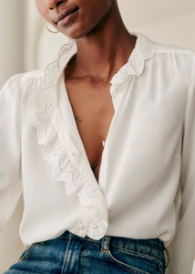 Elevate your style with the Chlo Shirt! Featuring a high collar and embroidered band, this long-sleeved shirt exudes sophistication. Covered buttons add a touch of elegance to complete the look. Make a statement with every step in this must-have for any fashion-forward individual.