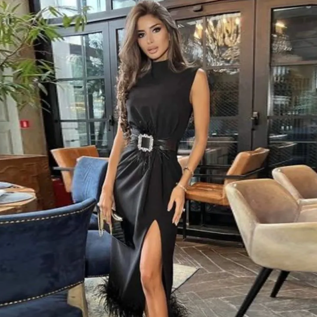 Get ready to rock the night in our Dress Lena! This daring black dress features a bandage design and a feather hem, perfect for those who love to take risks and make a statement. Don't settle for ordinary, step into the spotlight with our Black Feather Fashion Dress!