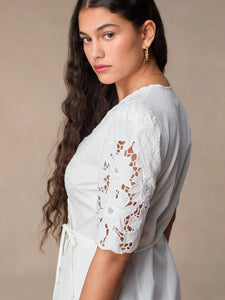 This stunning Audrey Midi Dress is perfect for any occasion. The elegant white embroidery adds a touch of sophistication, while the mid-length and wrap design create a flattering and versatile silhouette. Dress it up or down, this dress is sure to make you feel confident and chic!